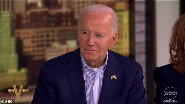 Biden pretends to squish a bug on the table on The View after Whoopi Goldberg compared Trump to an insect following two assassination attempts