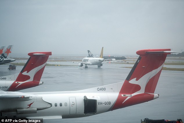 Sydney Airport chaos as flights are DELAYED after massive storm wreaks havoc